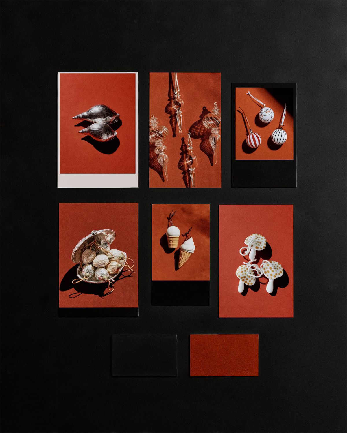Christmas ornament photos on rust-red backgrounds pinned in a grid on a black board, with two colour swatches
