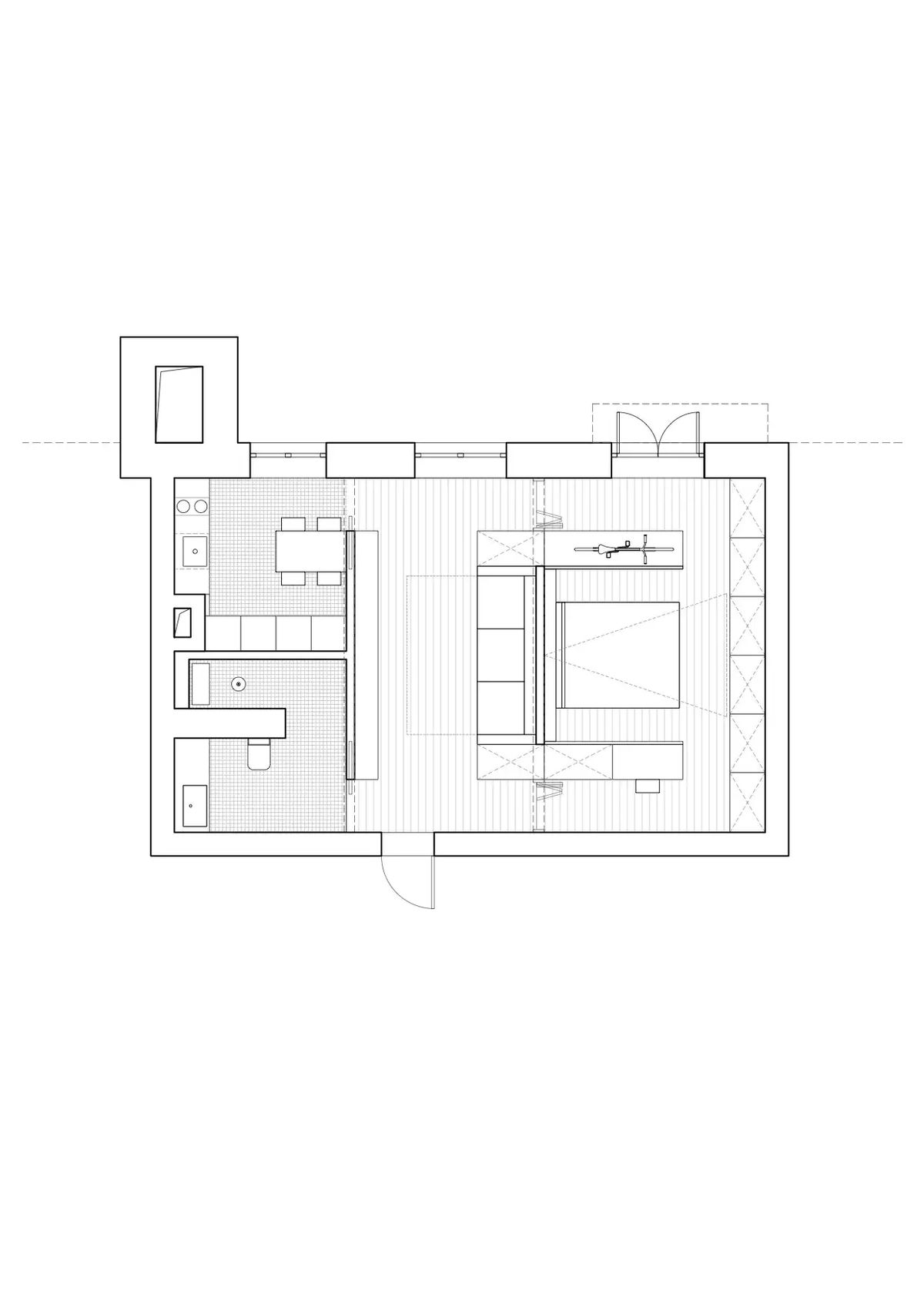 Floor plan of a one-room apartment with kitchen and dining area, bathroom and a central bed block