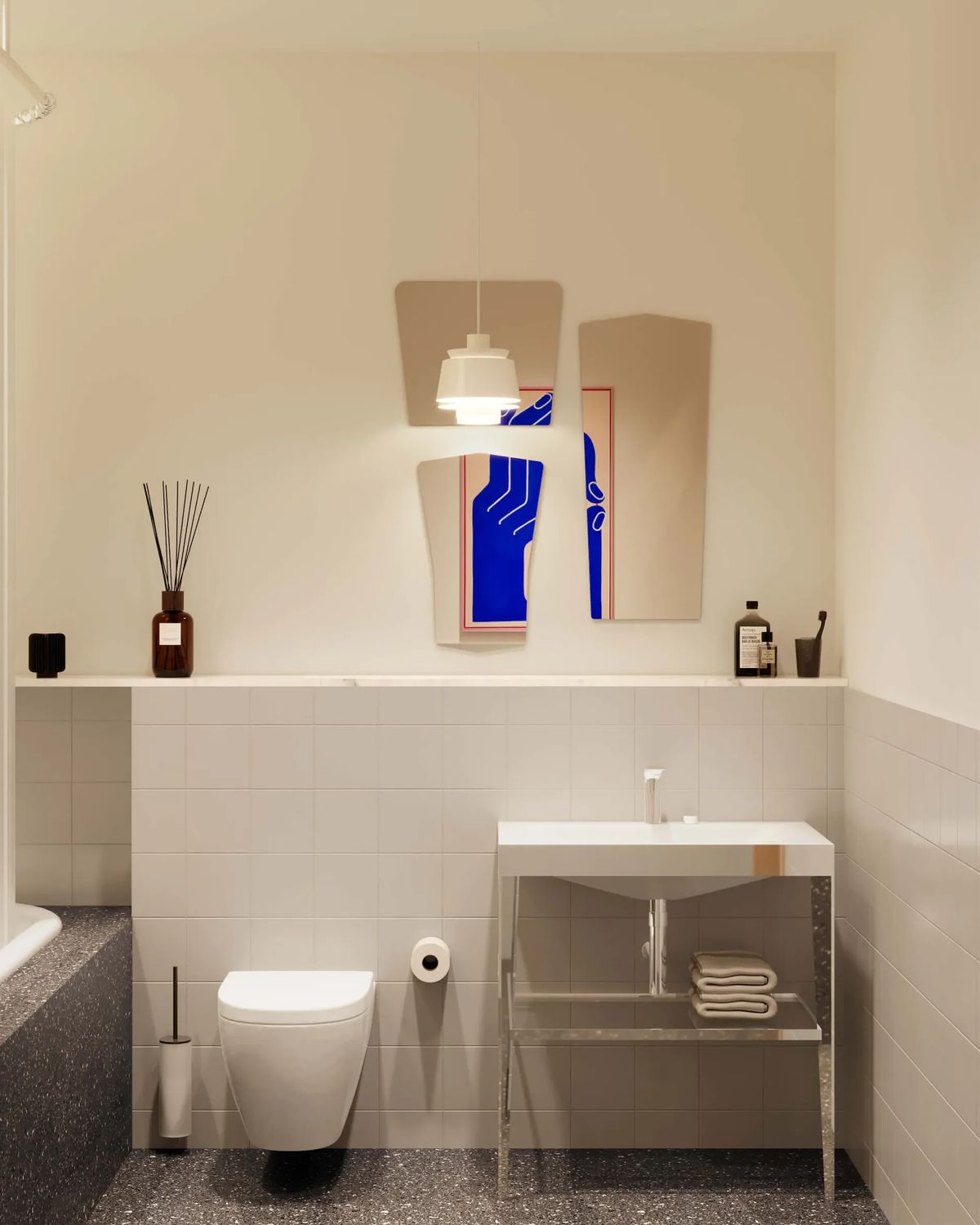 Bathroom with white tiles, terrazzo floor, a steel-legged washbasin and cut mirrors over blue artwork
