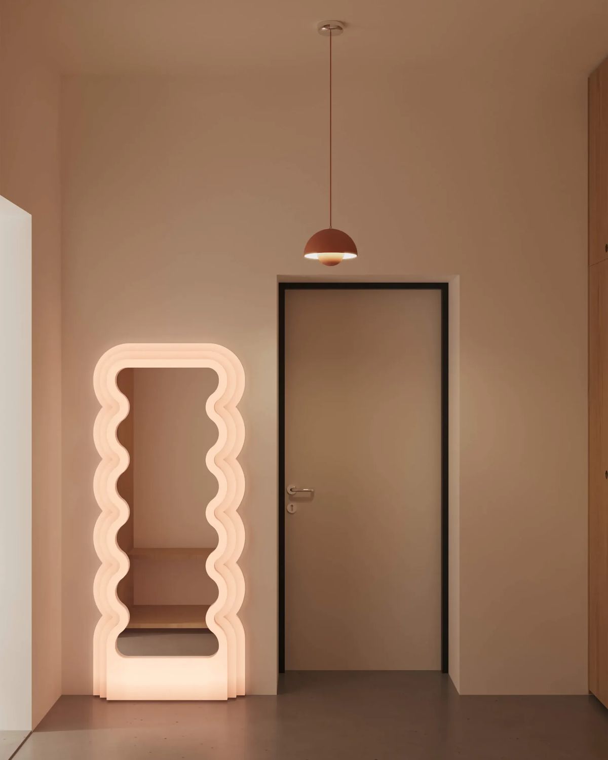 Warm-toned hallway with a glowing wavy floor mirror, terracotta dome pendant and a dark-framed door