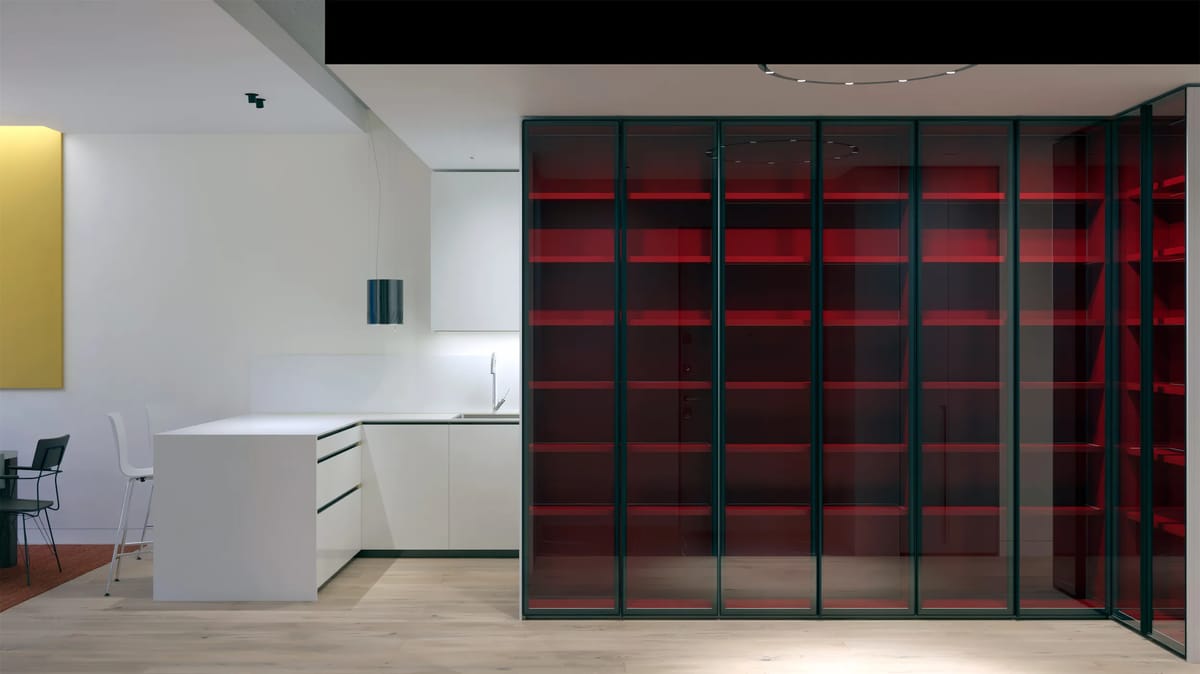 Render of a white kitchen island beside a tall glass cabinet with red-lit shelves