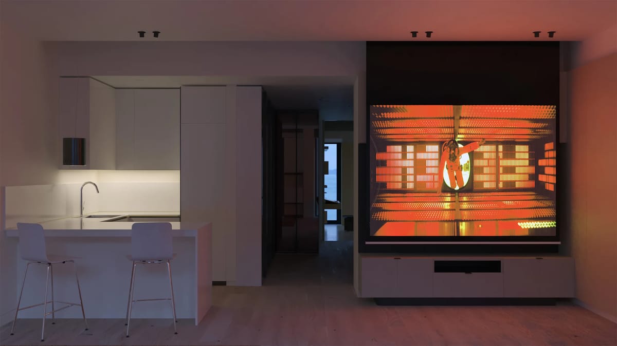 Render of the living room at night with a projected film beside a white kitchen bar with stools
