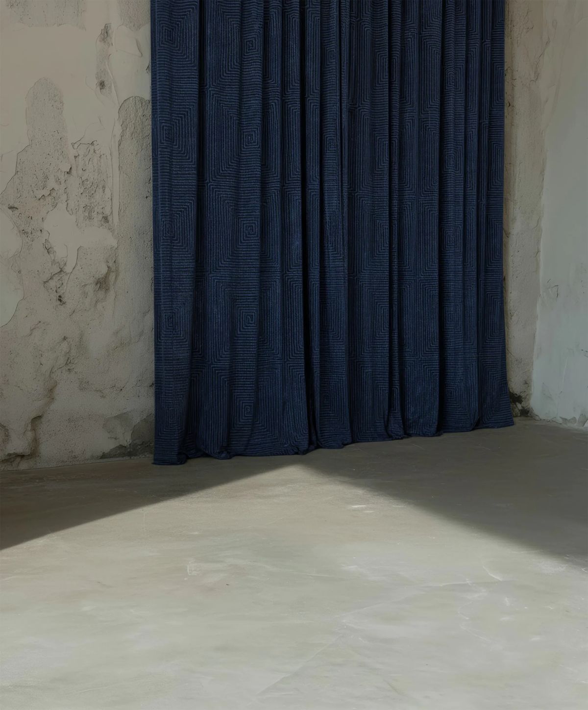 Blue geometric-patterned curtain against peeling white plaster walls in a sunlit virtual room