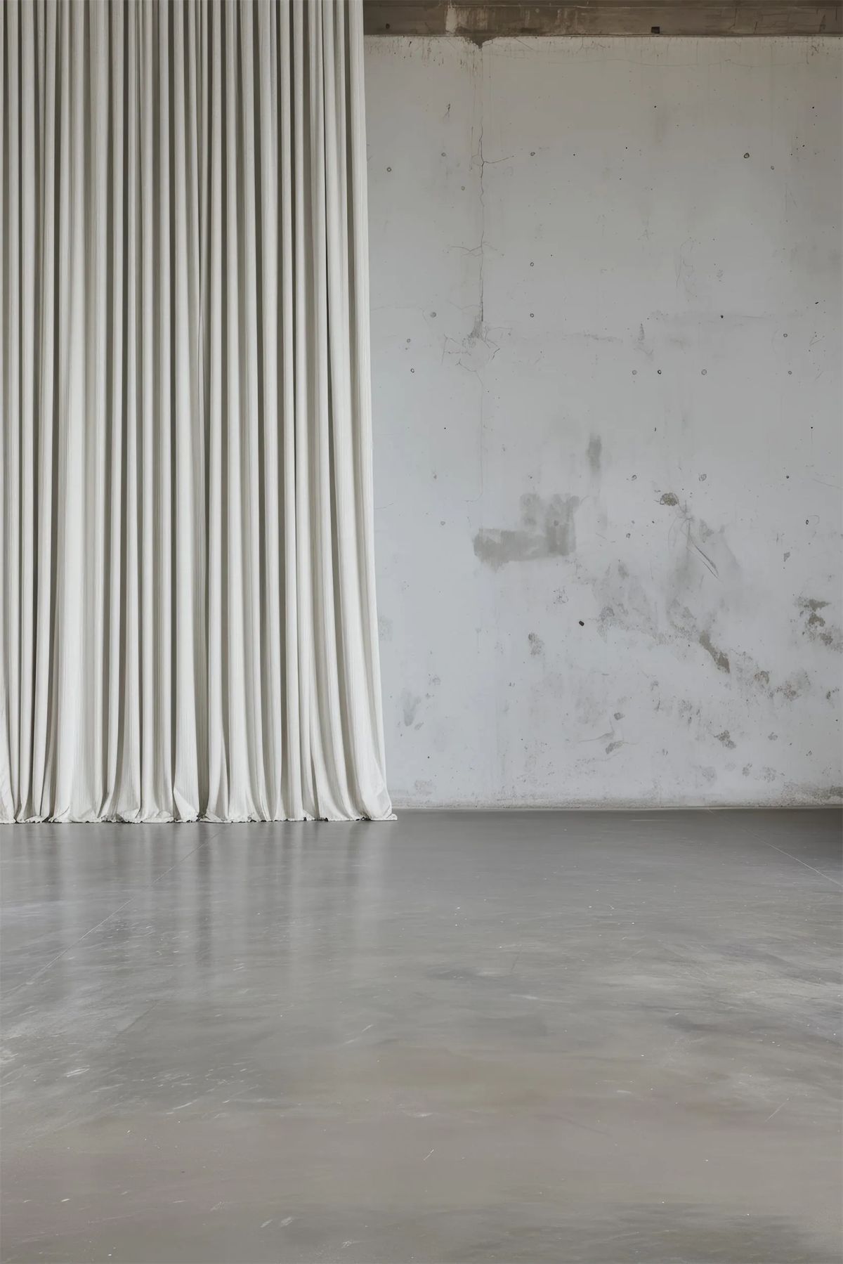 Tall pleated white curtain next to a bare concrete wall in an empty loft-like render