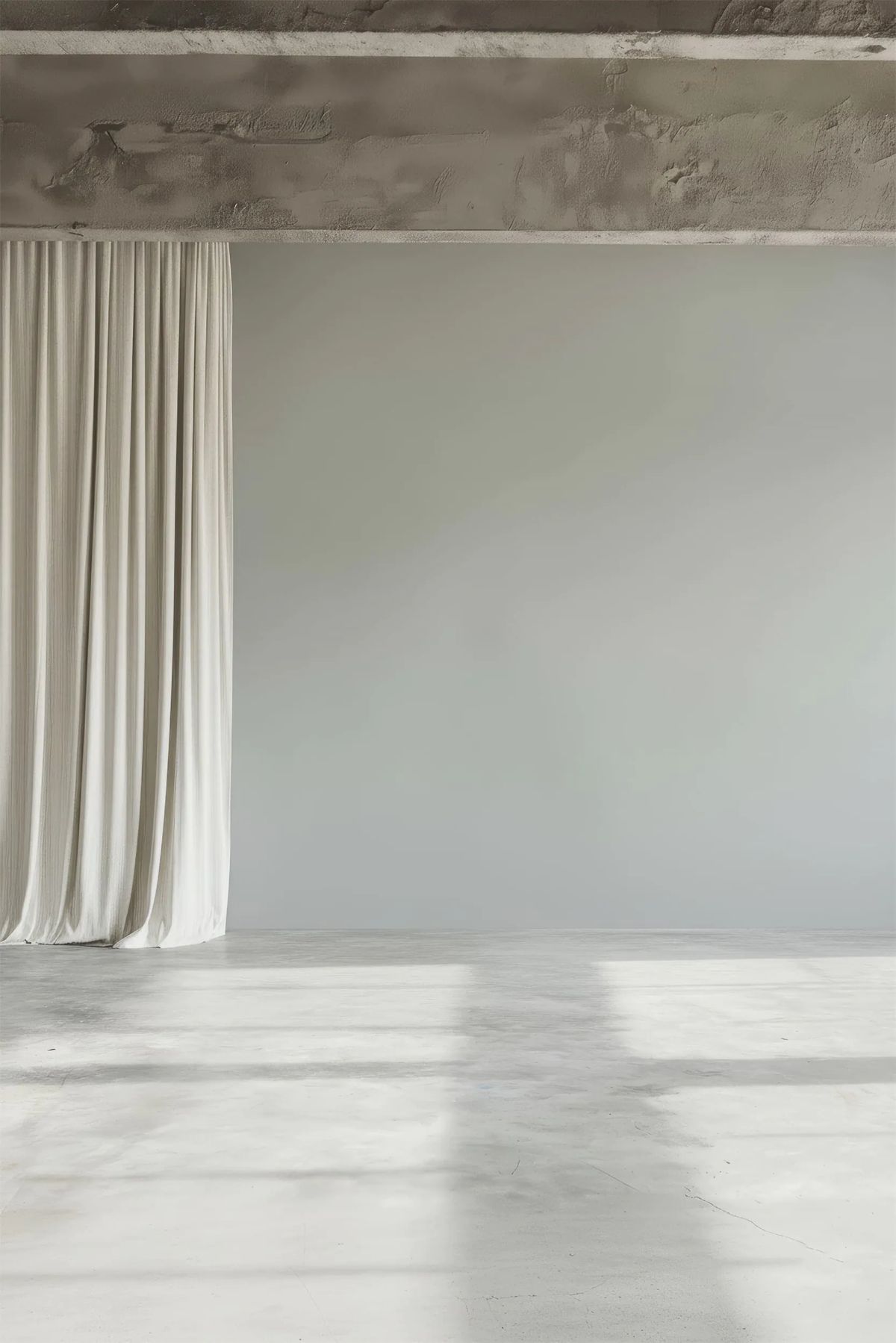 Cream curtain under a rough concrete beam, with window light falling on a pale floor